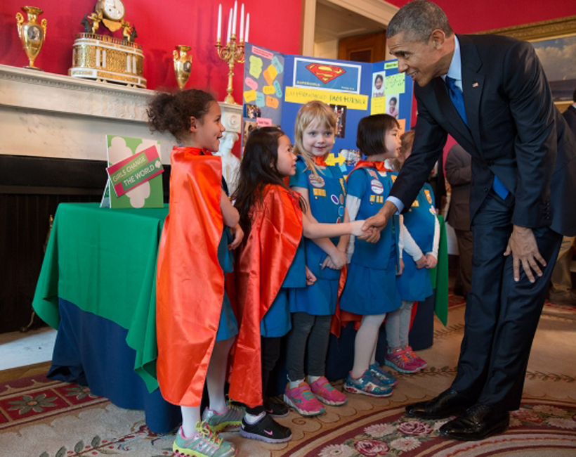President Barack Obama greets a Girl Scout troup from Tulsa, Oklahoma, as he viewed their science exhibit during the 2015 White House Science Fair celebrating student winners of a broad range of science, technology, engineering, and math (STEM) competitions, March 23, 2015. The girls used Lego pieces and designed a battery-powered page turner to help people who are paralyzed or have arthritis. (Official White House Photo by Pete Souza)